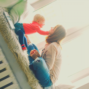 Au Pair and baby laughing