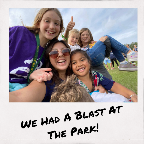 au pair and host children at the park