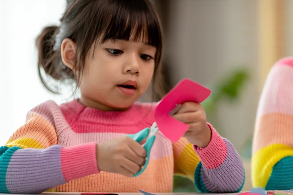 Child making Mexican crafts