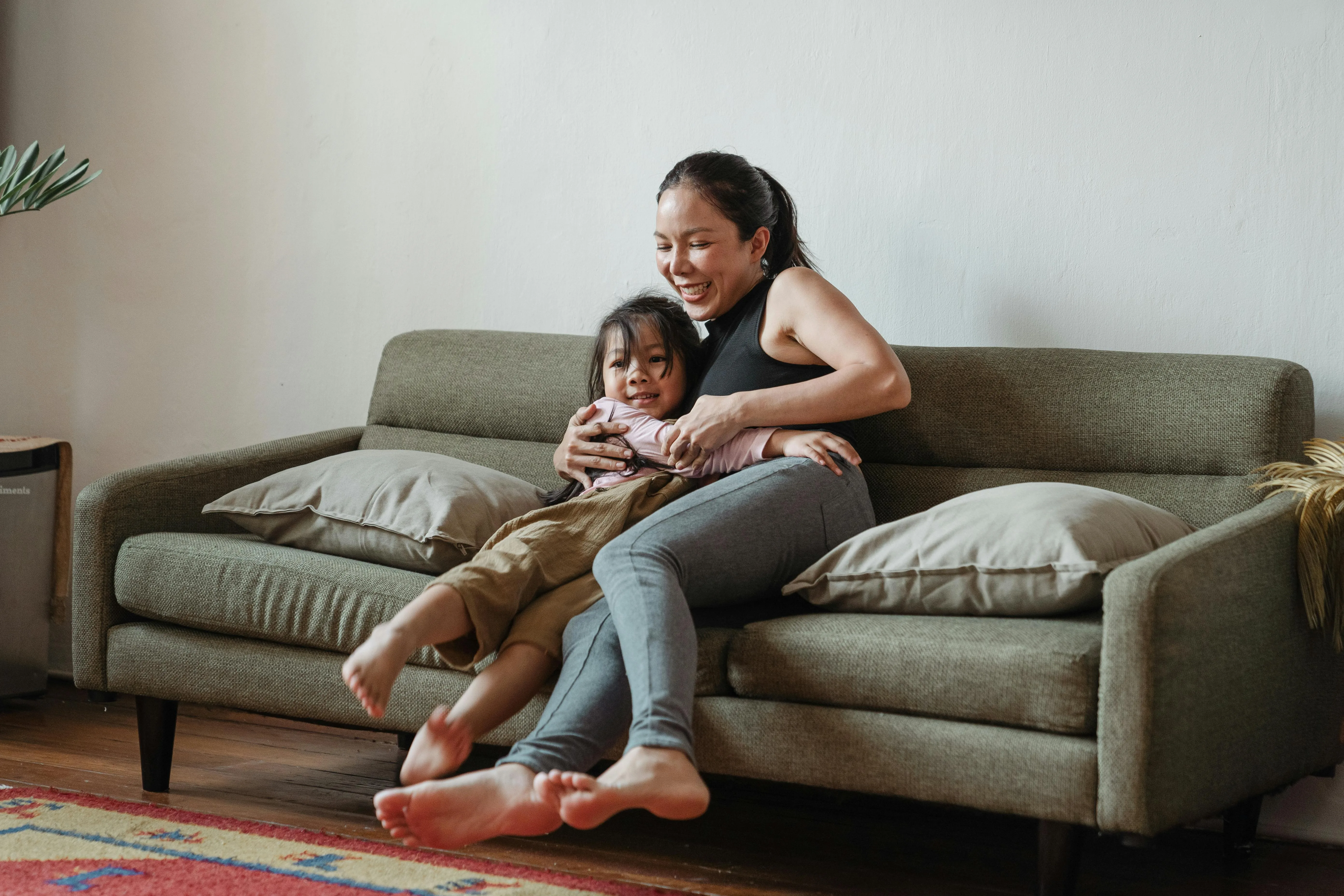 Au Pair and toddler watching tv