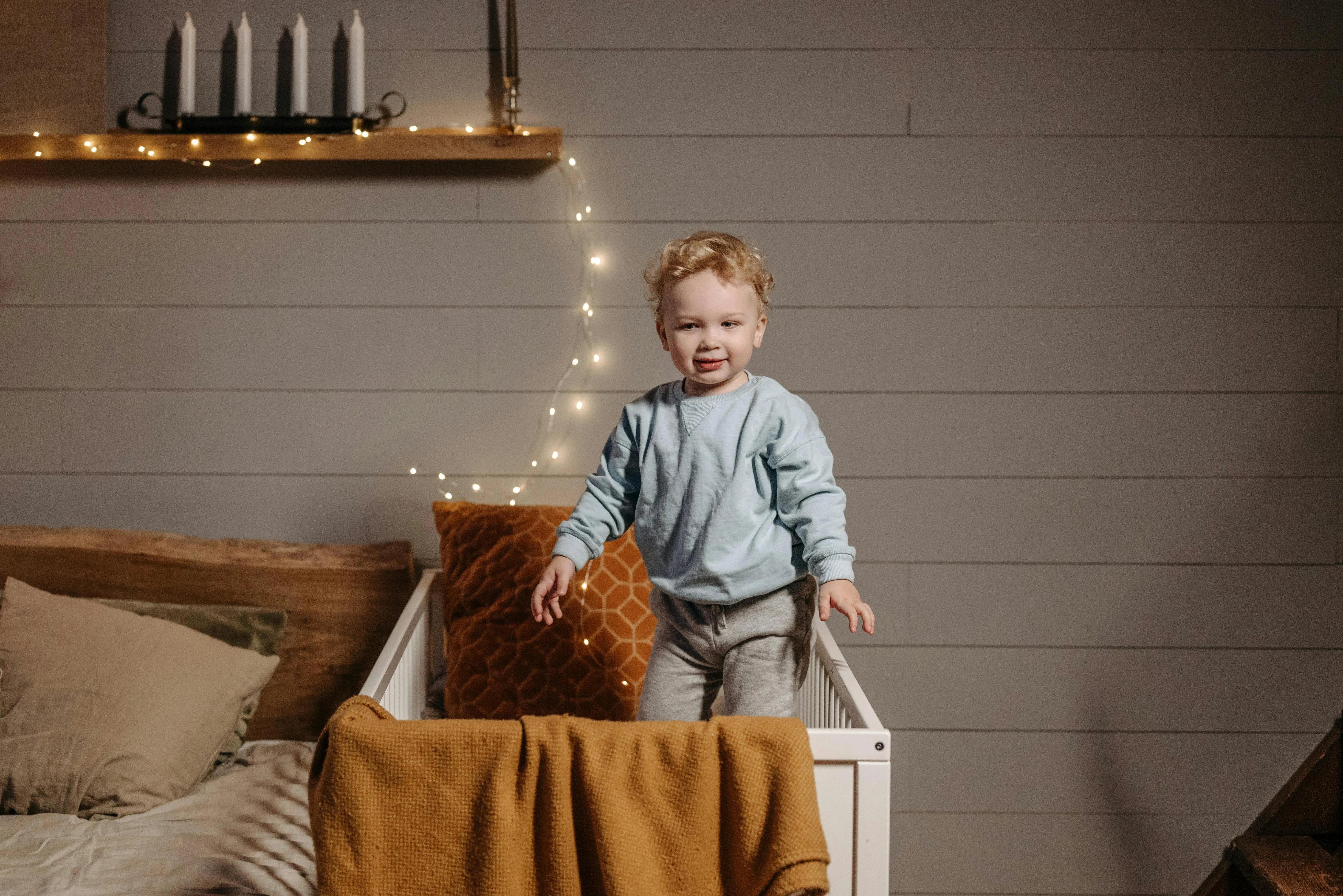 Toddler standing in crib