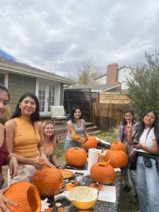Au Pairs in Denver carving pumpkins