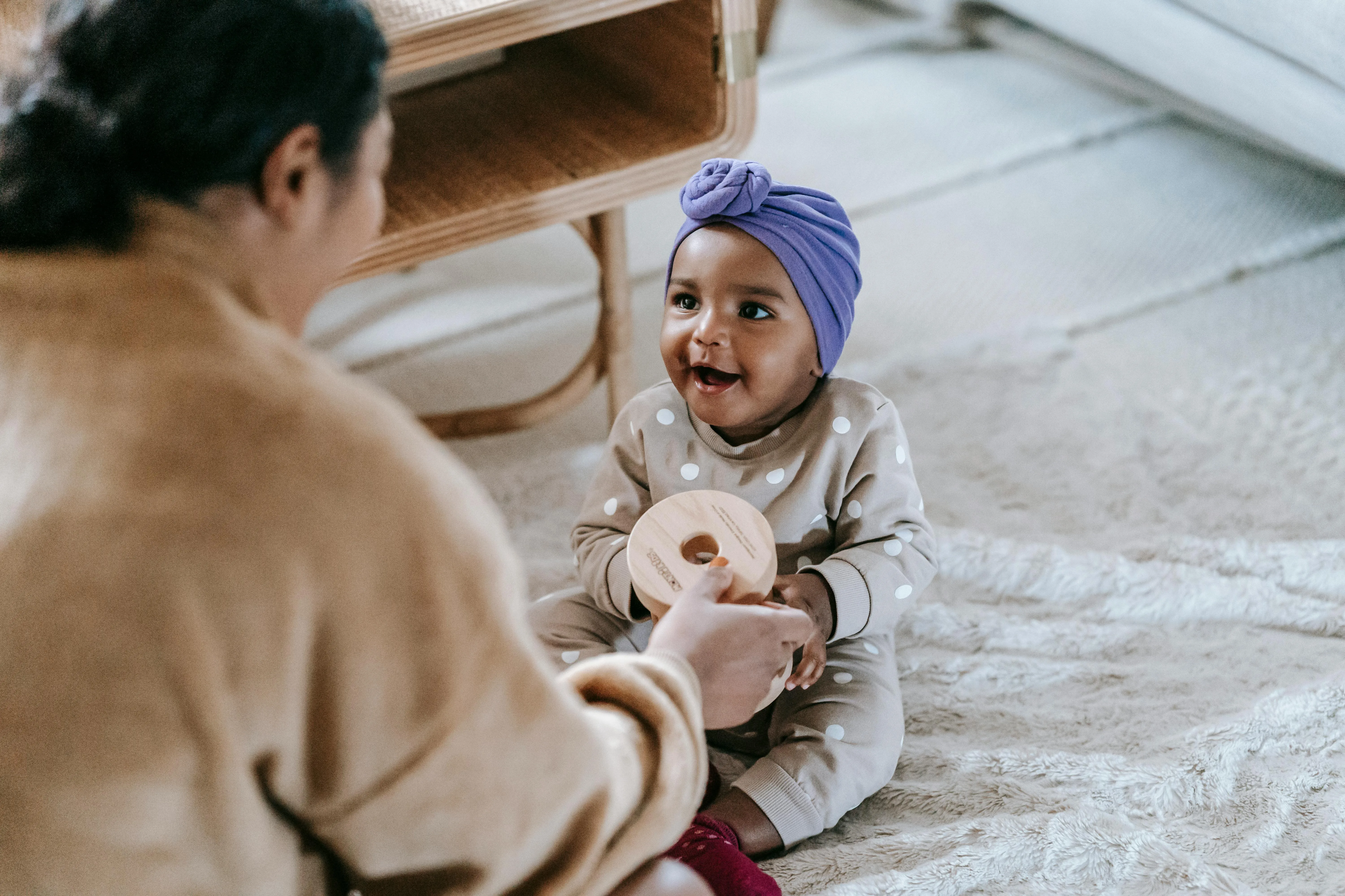 Au Pair and baby playing with blocks
