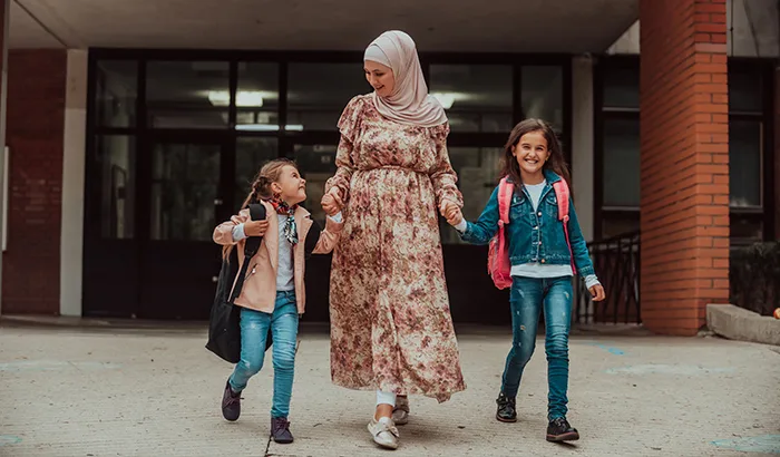 Parent taking children to school