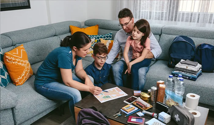 A family gathers to go over their emergency preparedness plan.