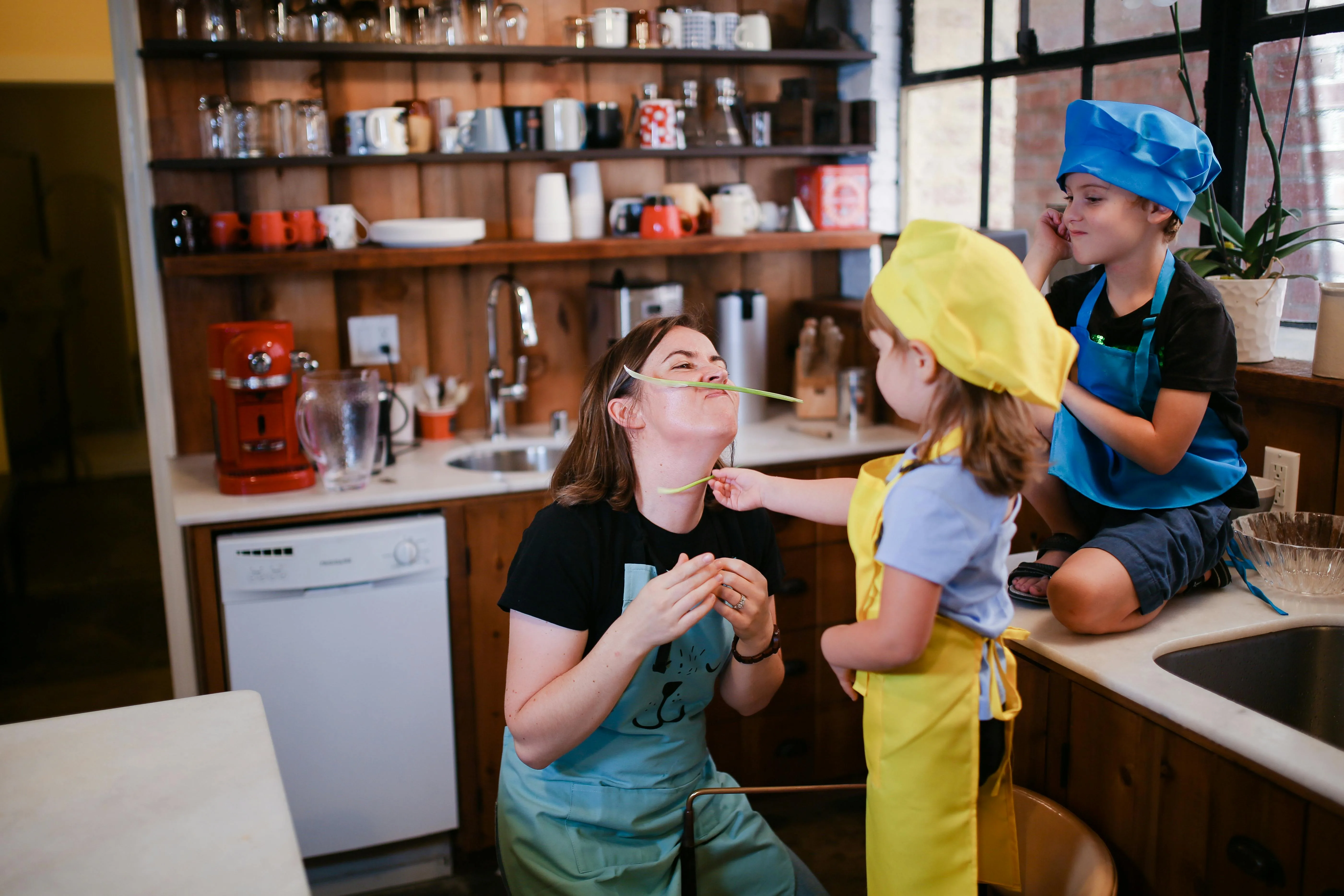 Au Pair and kids having fun in the kitchen