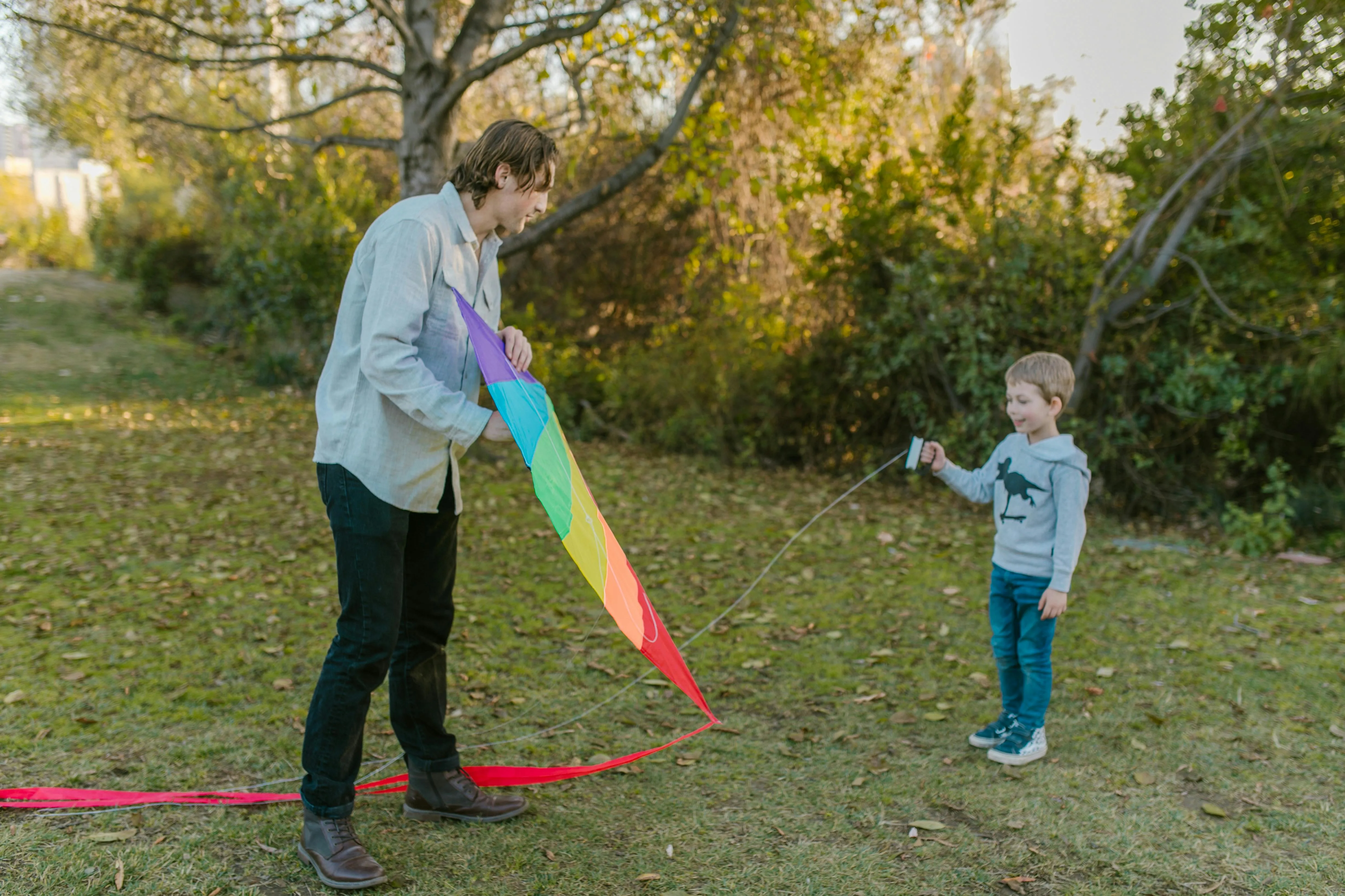 Au Pair and kid flying a kite