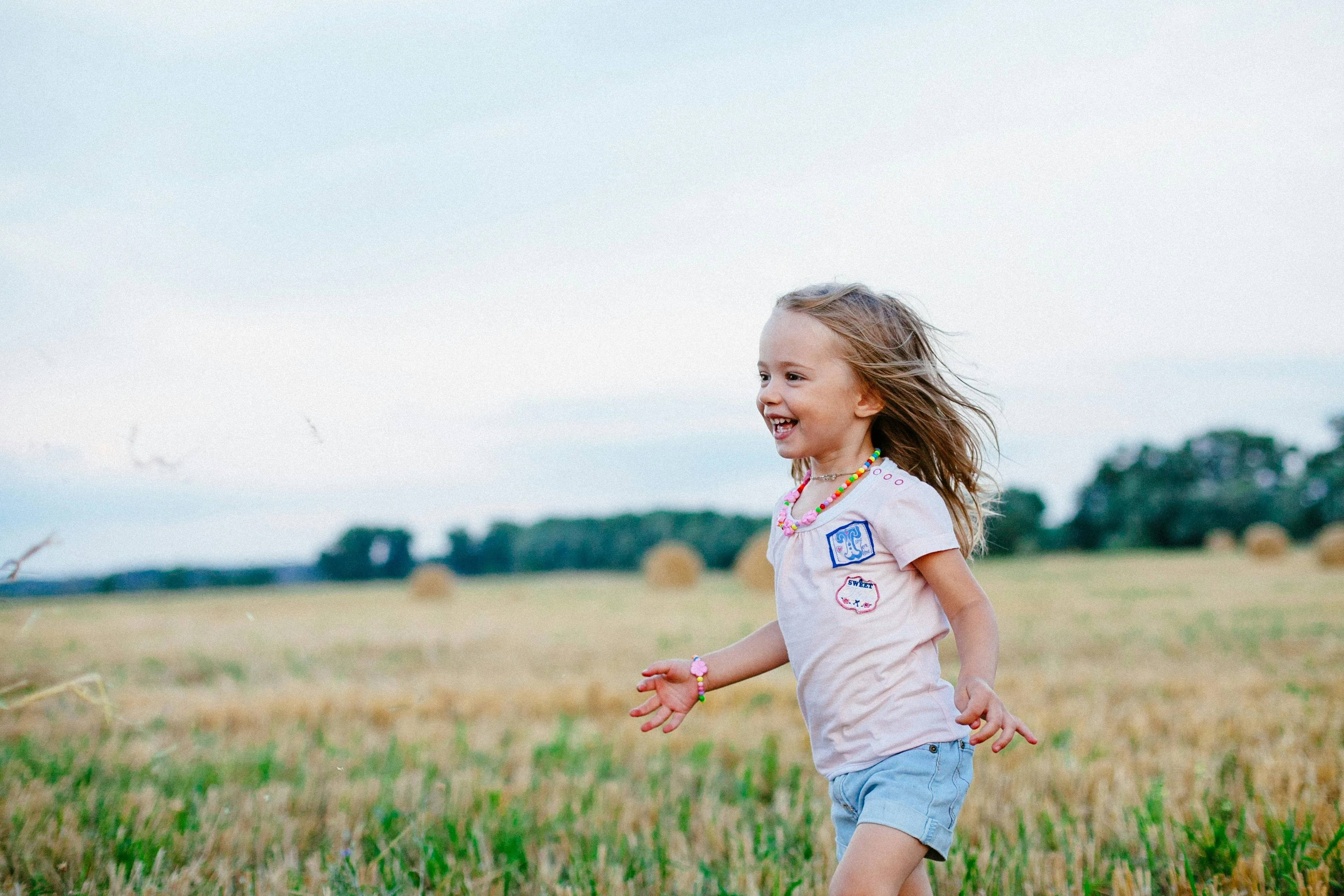 Young girl playing in a field