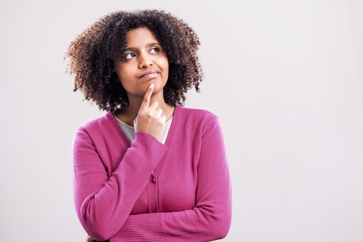 Young woman thinking if she can be an Au Pair without perfect English