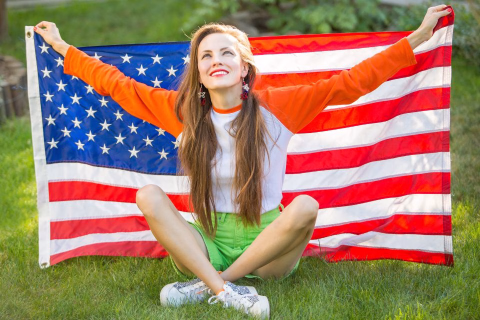 Au Pair holding U.S. flag