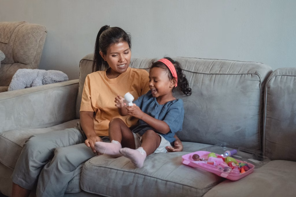 Au Pair playing with child