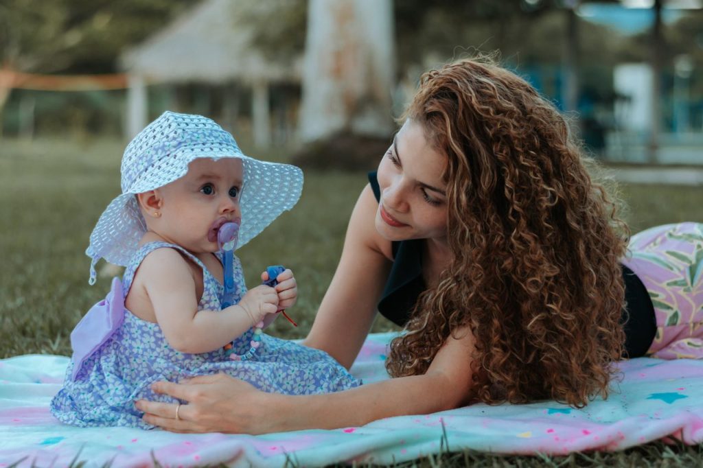 Au Pair and baby playing together