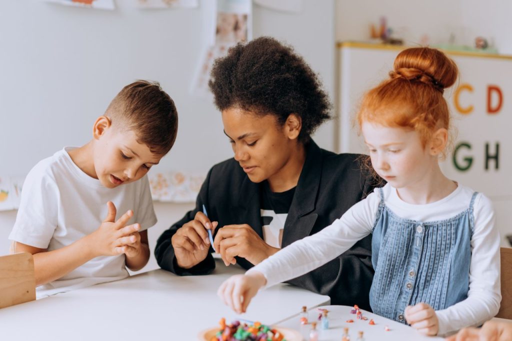 Au Pair playing with children.