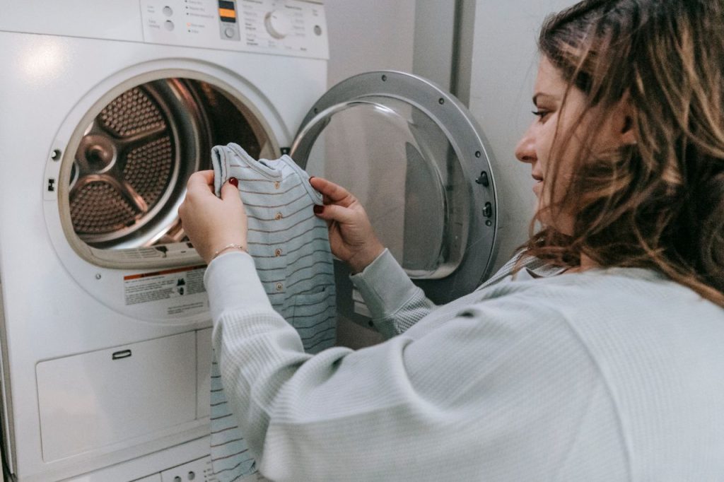 Au Pair doing children's laundry